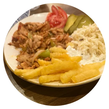 Shawarma plate with fries, coleslaw and tomato