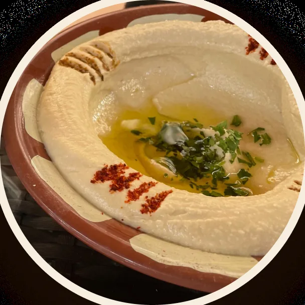 Hummus with olive oil, parsley and paprika