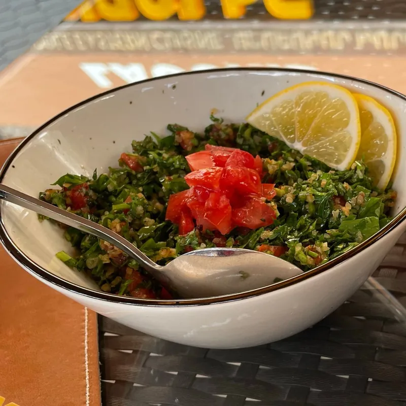 Tabbouleh with chopped tomato and lemon